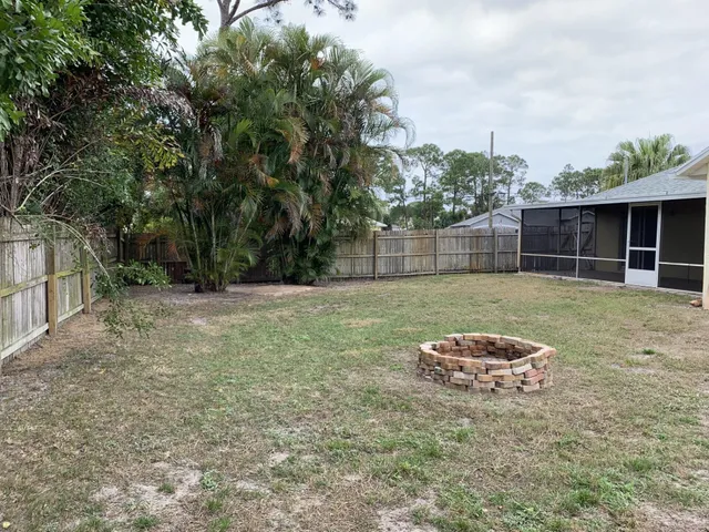 a backyard of a house with lots of green space