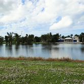 a view of a lake with houses in the back