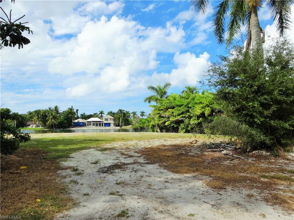610 Banyan Circle Naples, FL 34102 - Photo 14 of 15 a view of a yard with an trees