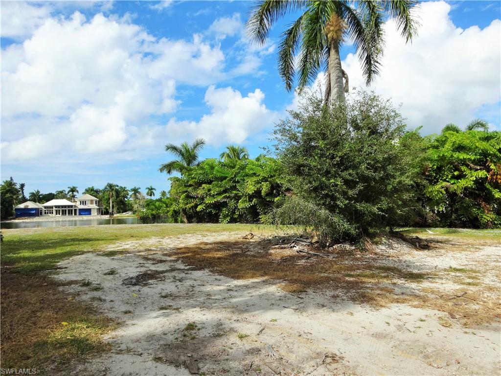 610 Banyan Circle Naples, FL 34102 - Photo 15 of 15 a view of a yard with a trees