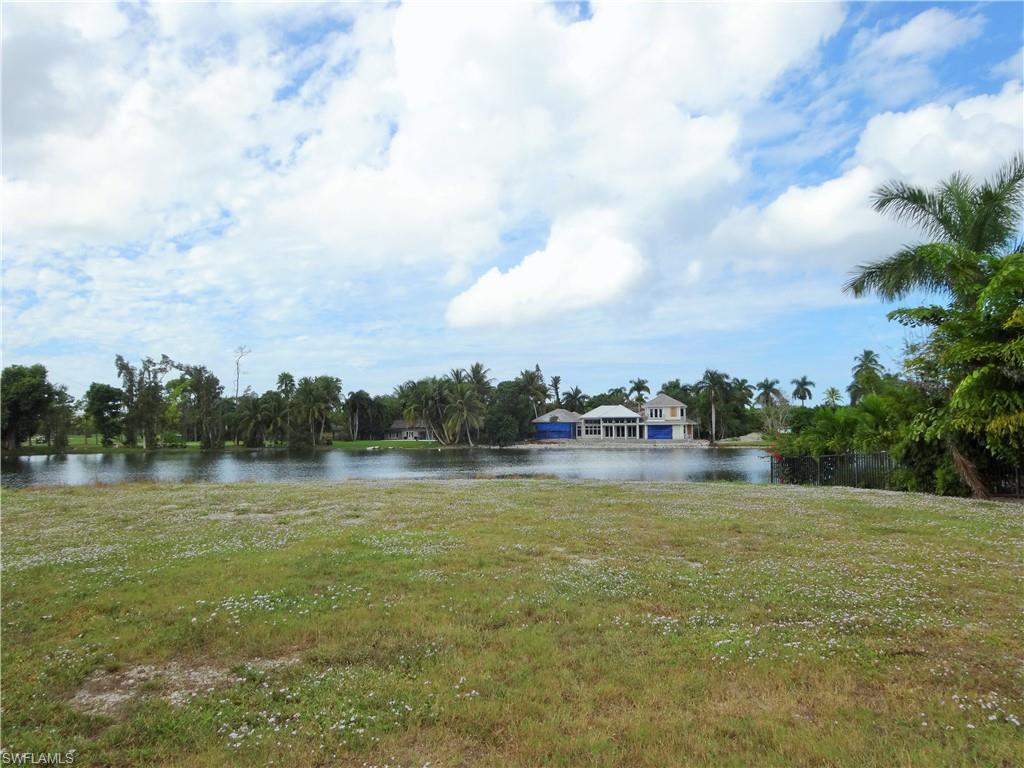 610 Banyan Circle Naples, FL 34102 - Photo 5 of 15 a view of outdoor space with swimming pool and trees in the background
