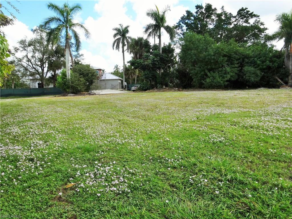 610 Banyan Circle Naples, FL 34102 - Photo 7 of 15 a view of green field with trees in the background