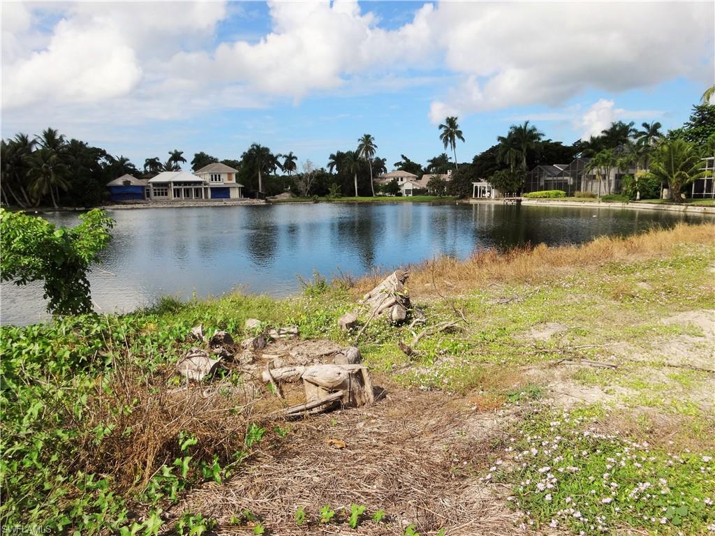 610 Banyan Circle Naples, FL 34102 - Photo 10 of 15 a view of a lake with houses