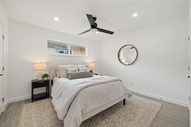 a kitchen with a sink cabinets and wooden floor