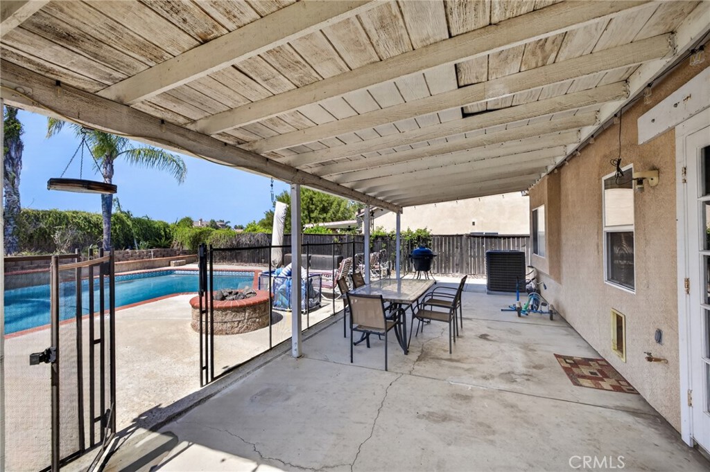 807 Lomond Drive Riverside, CA 92508 - Photo 40 of 47 Back downstairs and in the backyard, covered patio and firepit via French doors from the flex space.