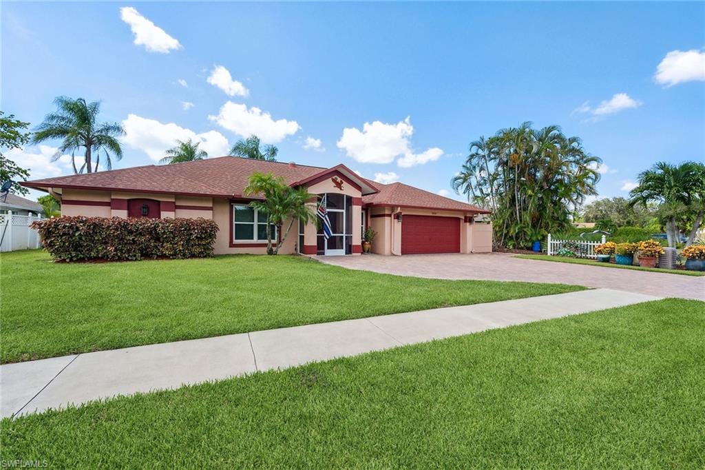900 Hidden Harbour Drive Naples, FL 34109 - Photo 1 of 32 a front view of a house with a yard