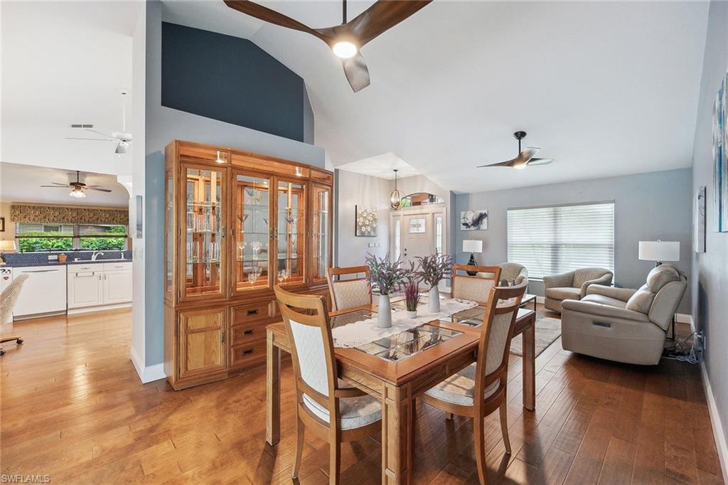 900 Hidden Harbour Drive Naples, FL 34109 - Photo 32 of 32 a view of a dining room with furniture window and wooden floor