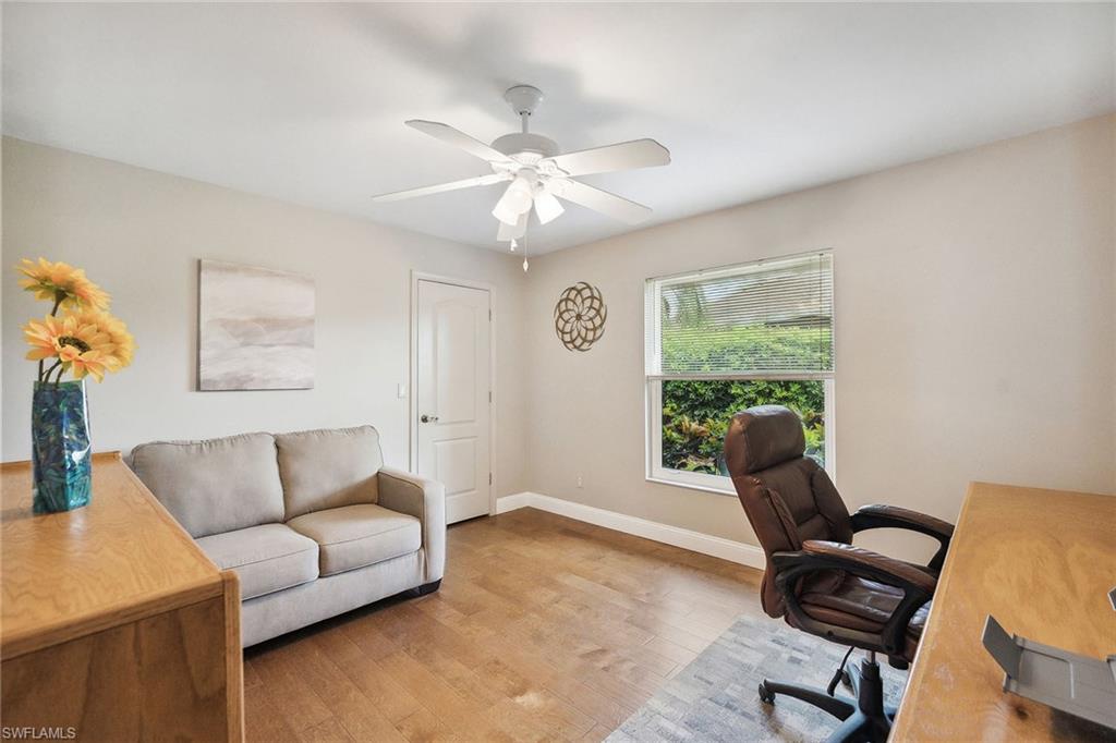 900 Hidden Harbour Drive Naples, FL 34109 - Photo 12 of 32 a living room with furniture and a window