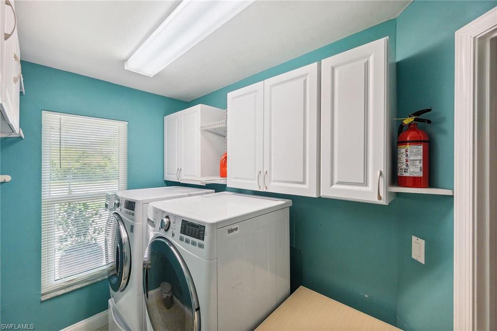900 Hidden Harbour Drive Naples, FL 34109 - Photo 21 of 32 a utility room with dryer and washer