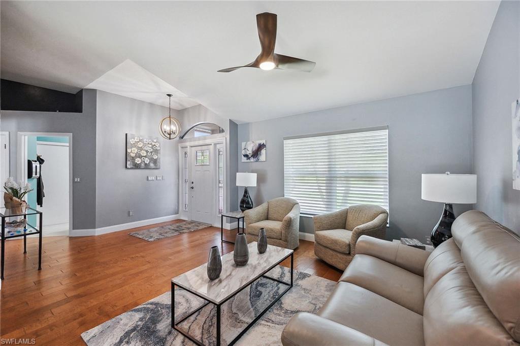 900 Hidden Harbour Drive Naples, FL 34109 - Photo 3 of 32 a living room with furniture