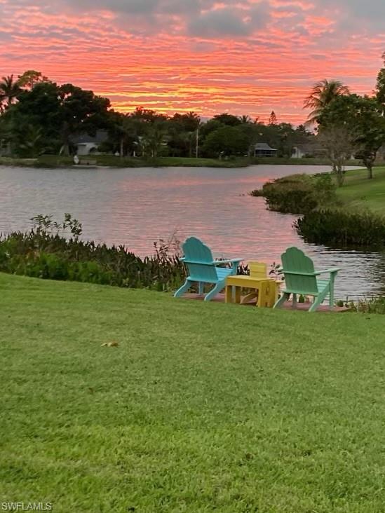 900 Hidden Harbour Drive Naples, FL 34109 - Photo 31 of 32 a view of a lake with a yard