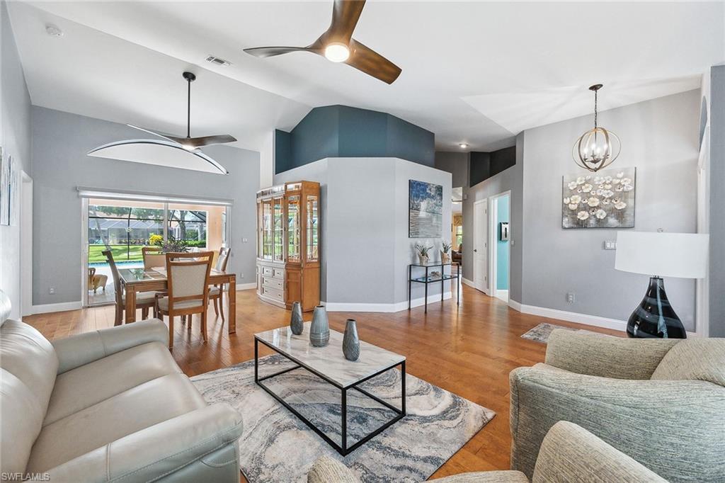 900 Hidden Harbour Drive Naples, FL 34109 - Photo 5 of 32 a living room with furniture and wooden floor