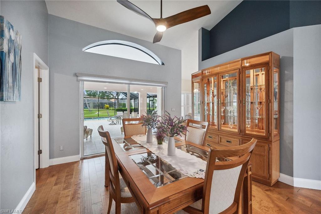 900 Hidden Harbour Drive Naples, FL 34109 - Photo 10 of 32 a dining room with furniture window and wooden floor
