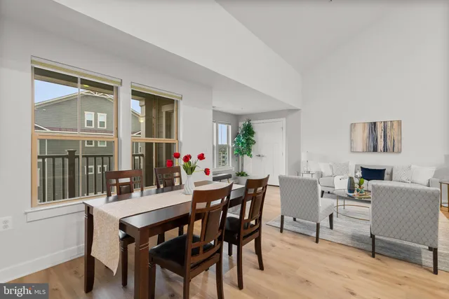 a view of a dining room with furniture and window