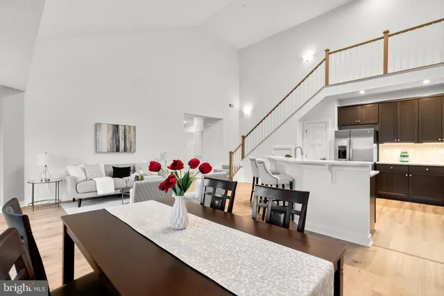 a living room with lots of furniture and white walls