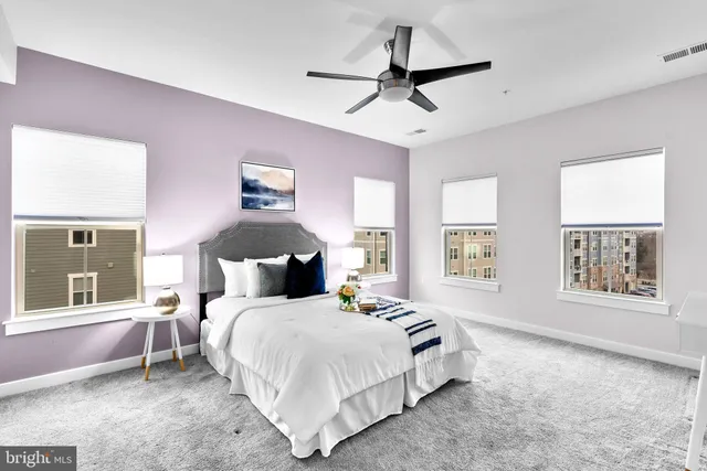 a spacious bedroom with a large bed and a window