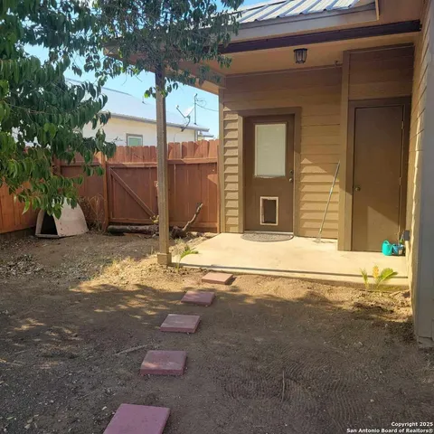 a view of a house with a snow in the yard