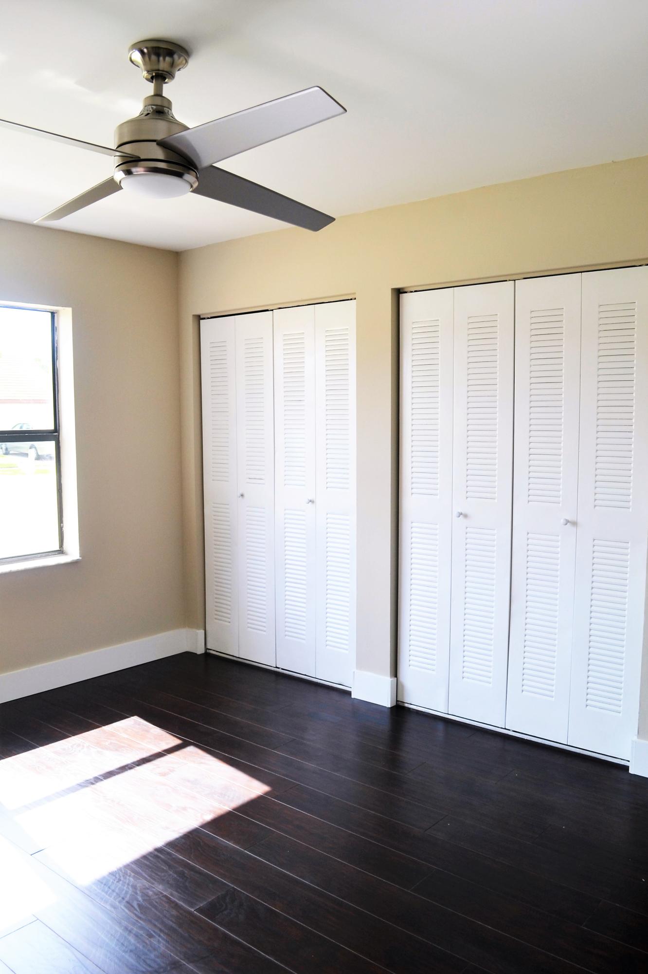 9540 El Clair Ranch Road Boynton Beach, FL 33437 - Photo 11 of 26 a view of an empty room with wooden floor