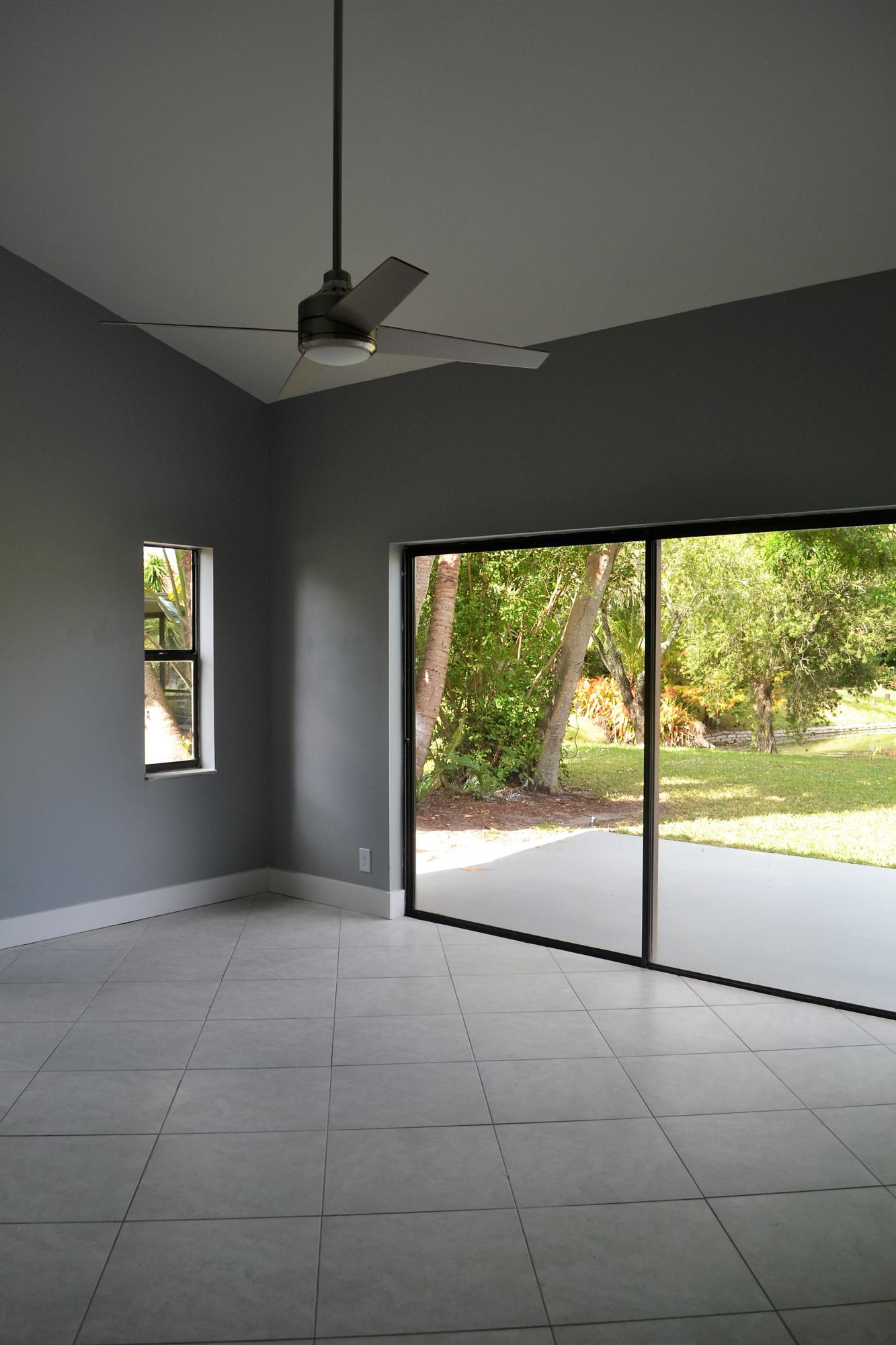 9540 El Clair Ranch Road Boynton Beach, FL 33437 - Photo 15 of 26 a view of an empty room with a window