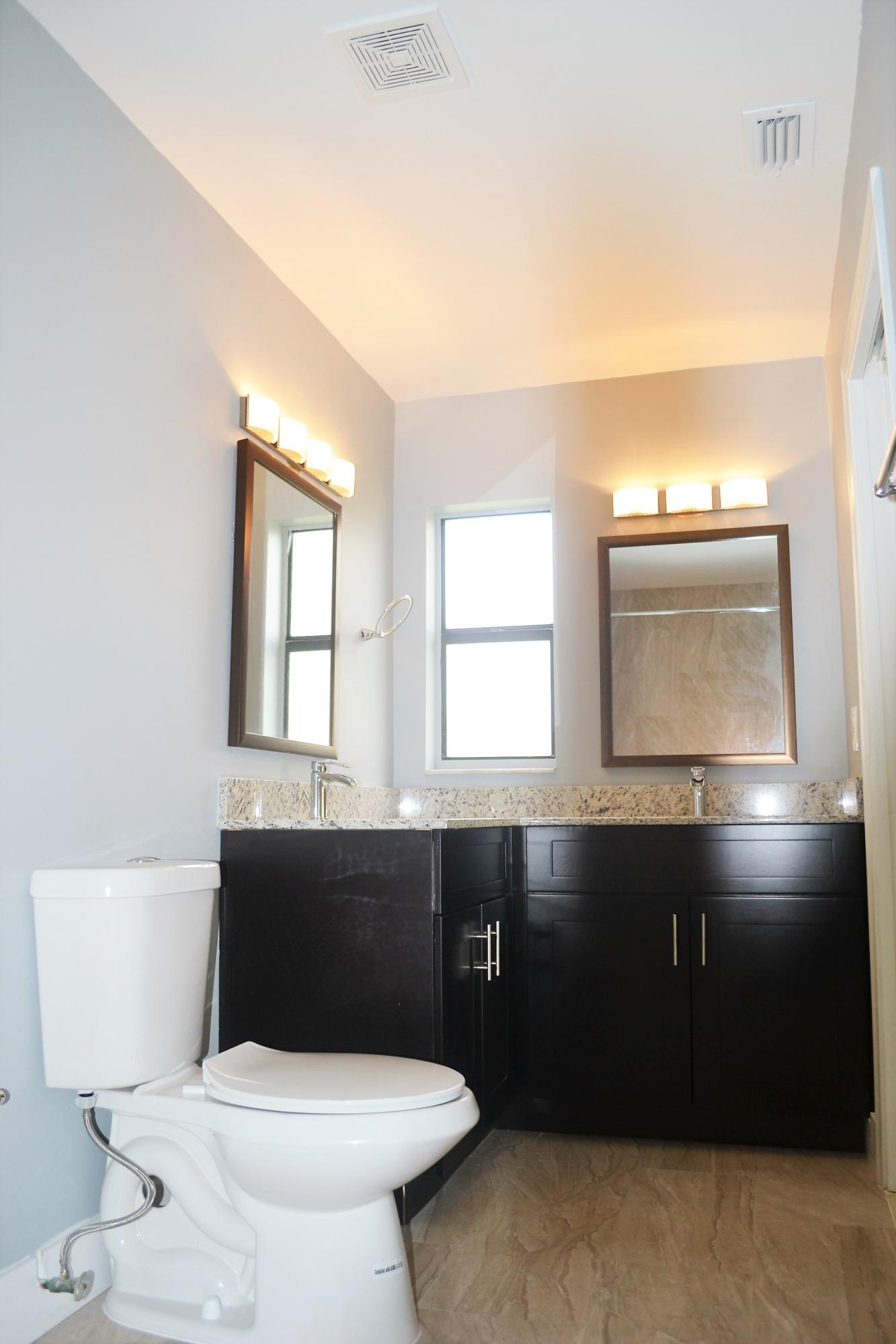 9540 El Clair Ranch Road Boynton Beach, FL 33437 - Photo 17 of 26 a bathroom with a sink and a toilet