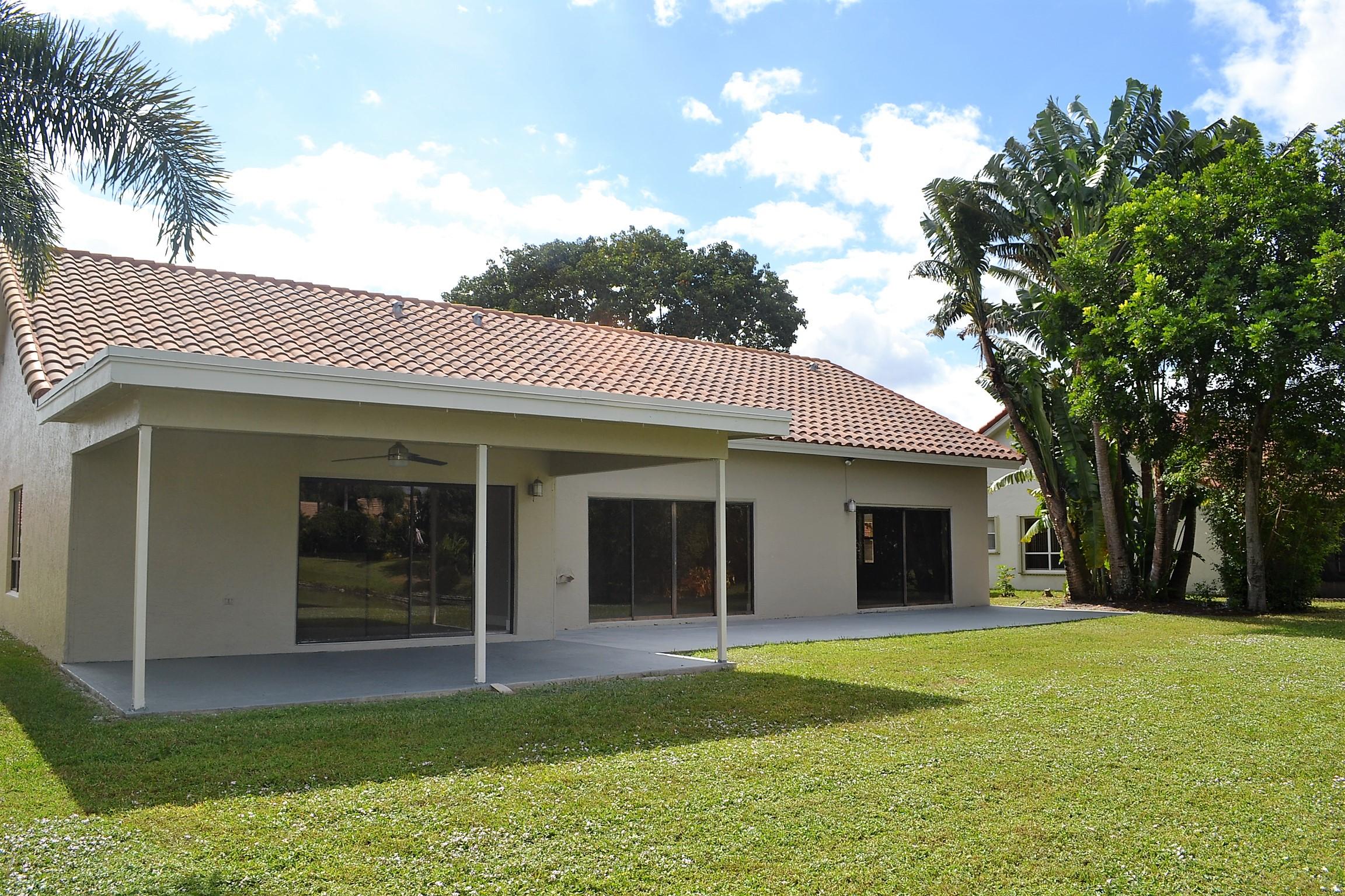 9540 El Clair Ranch Road Boynton Beach, FL 33437 - Photo 22 of 26 a view of a house with a yard