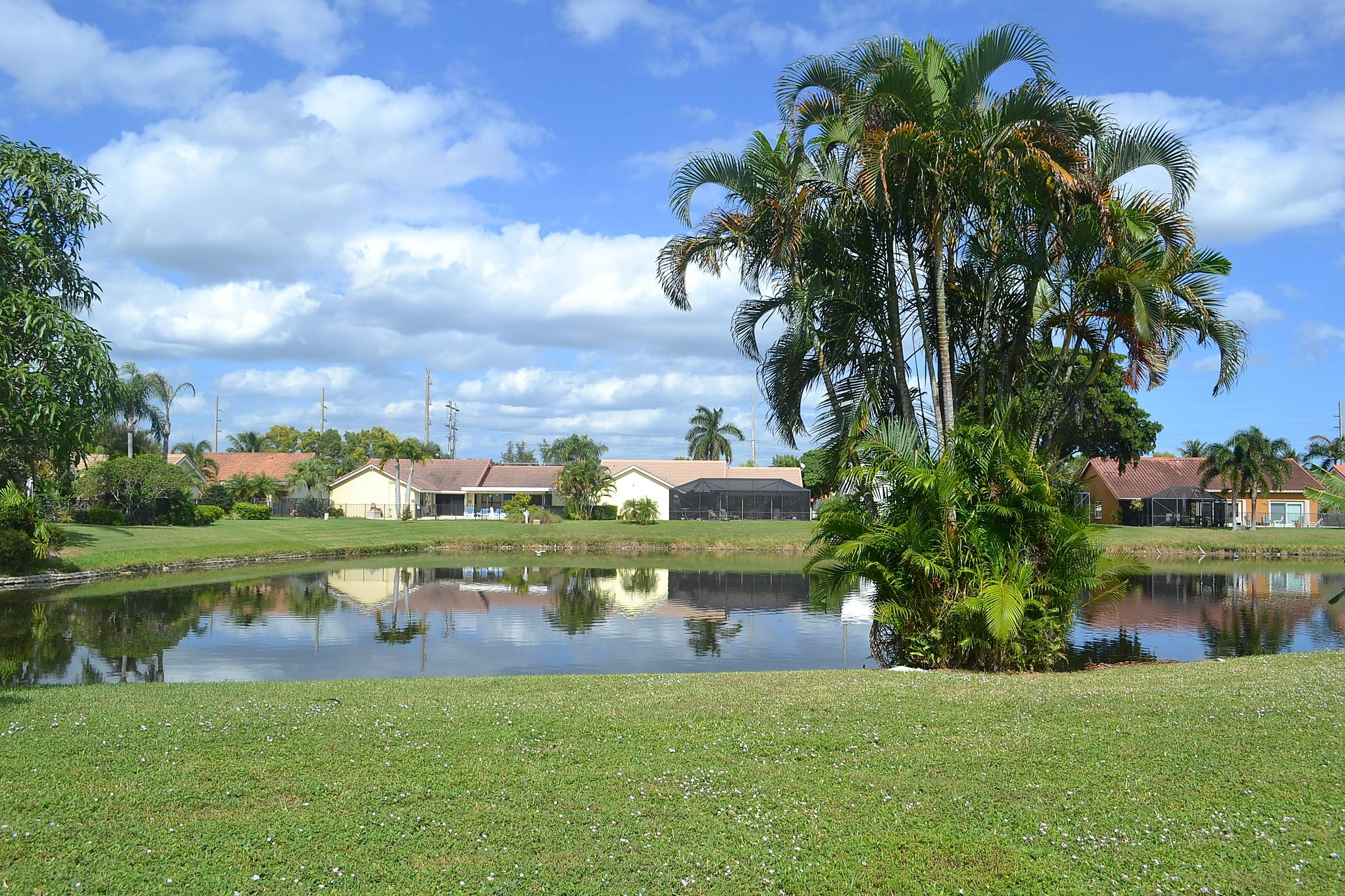 9540 El Clair Ranch Road Boynton Beach, FL 33437 - Photo 24 of 26 a view of a lake with a big yard