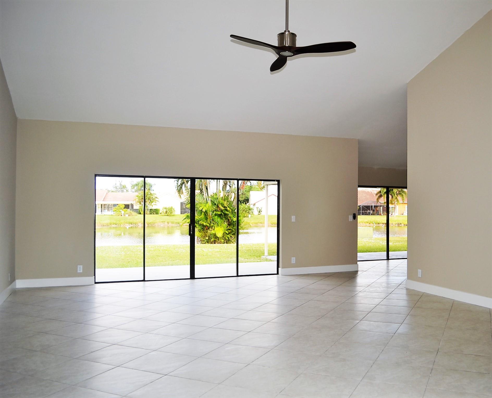 9540 El Clair Ranch Road Boynton Beach, FL 33437 - Photo 4 of 26 an empty room with windows