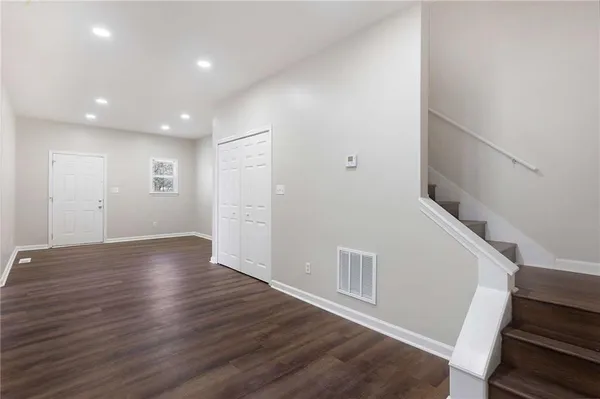 a view of entryway with wooden floor
