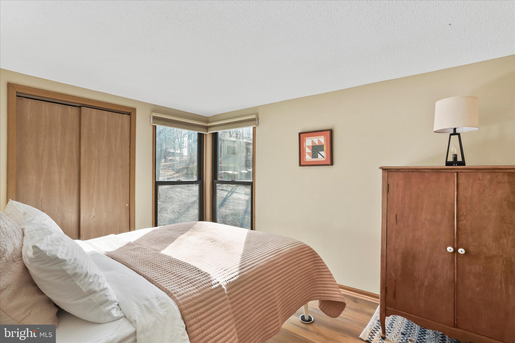 321 Clubhouse Ridge Hedgesville, WV 25427 - Photo 14 of 36 a bedroom with a bed and a window