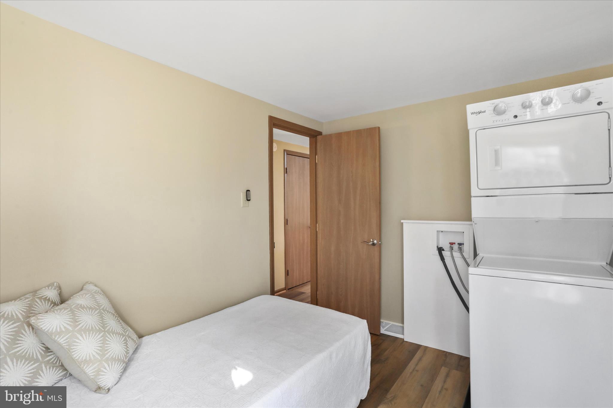 321 Clubhouse Ridge Hedgesville, WV 25427 - Photo 17 of 36 a bedroom with a bed and a refrigerator