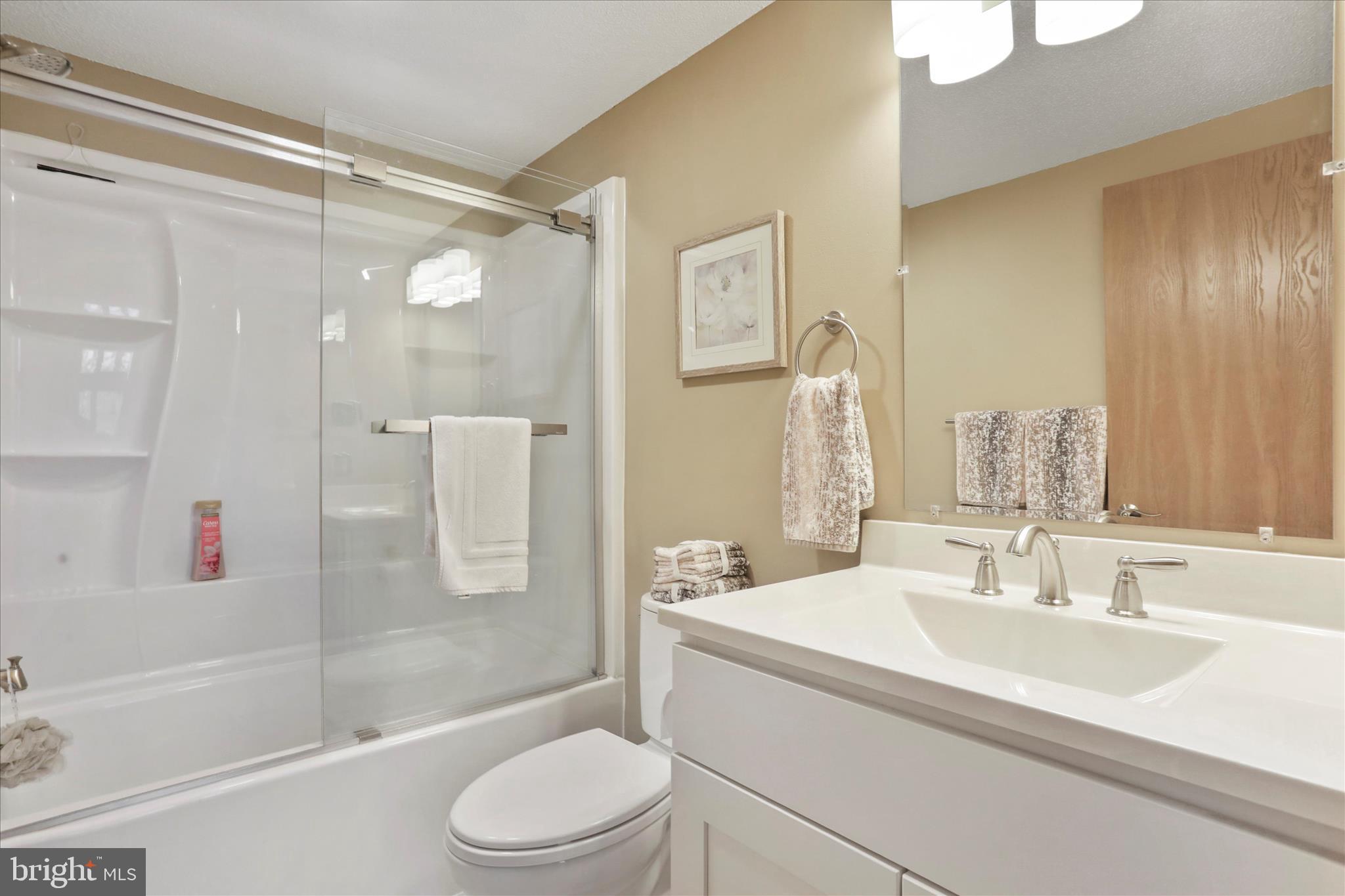 321 Clubhouse Ridge Hedgesville, WV 25427 - Photo 18 of 36 a bathroom with a sink toilet and shower