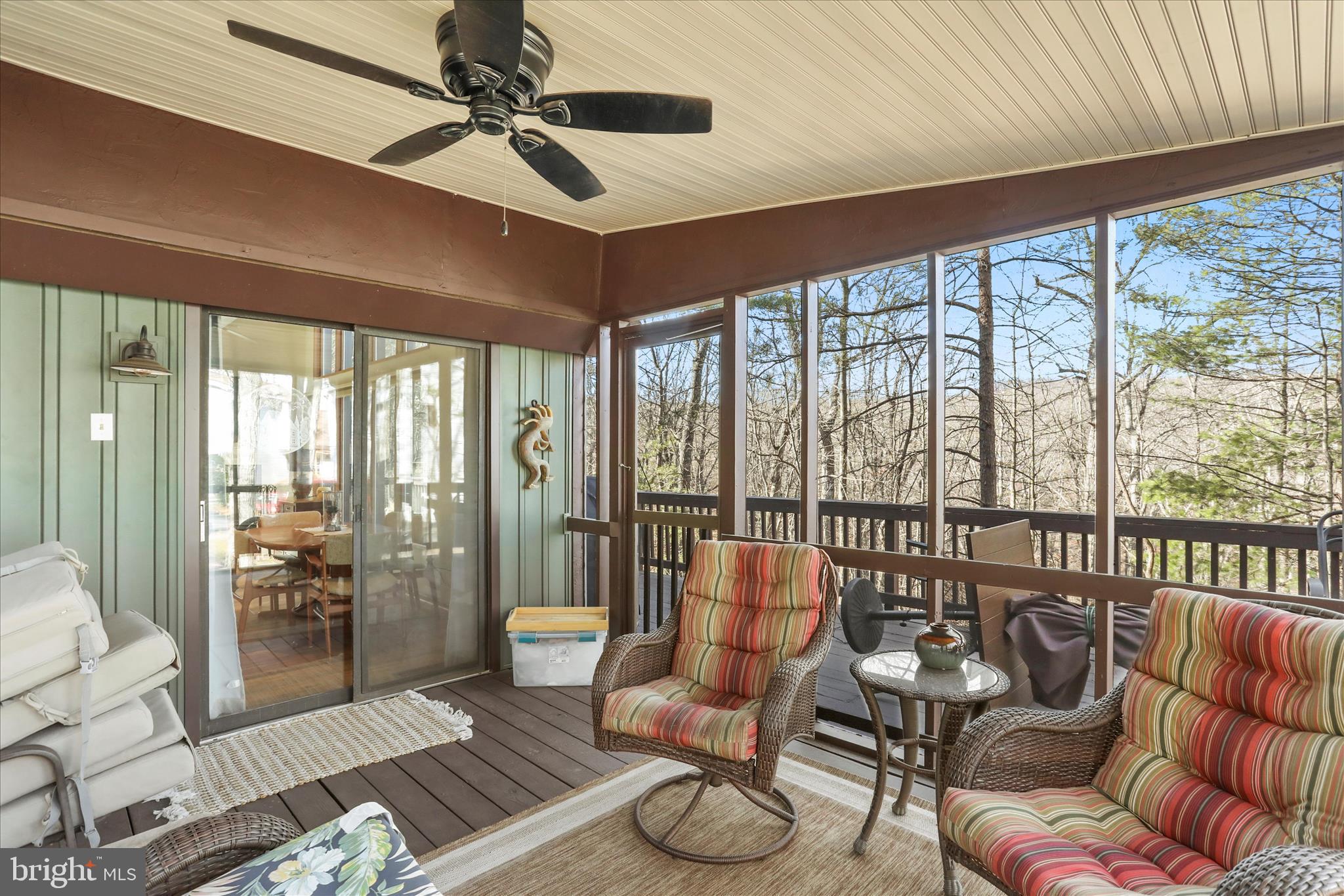 321 Clubhouse Ridge Hedgesville, WV 25427 - Photo 19 of 36 a living room with furniture and floor to ceiling windows