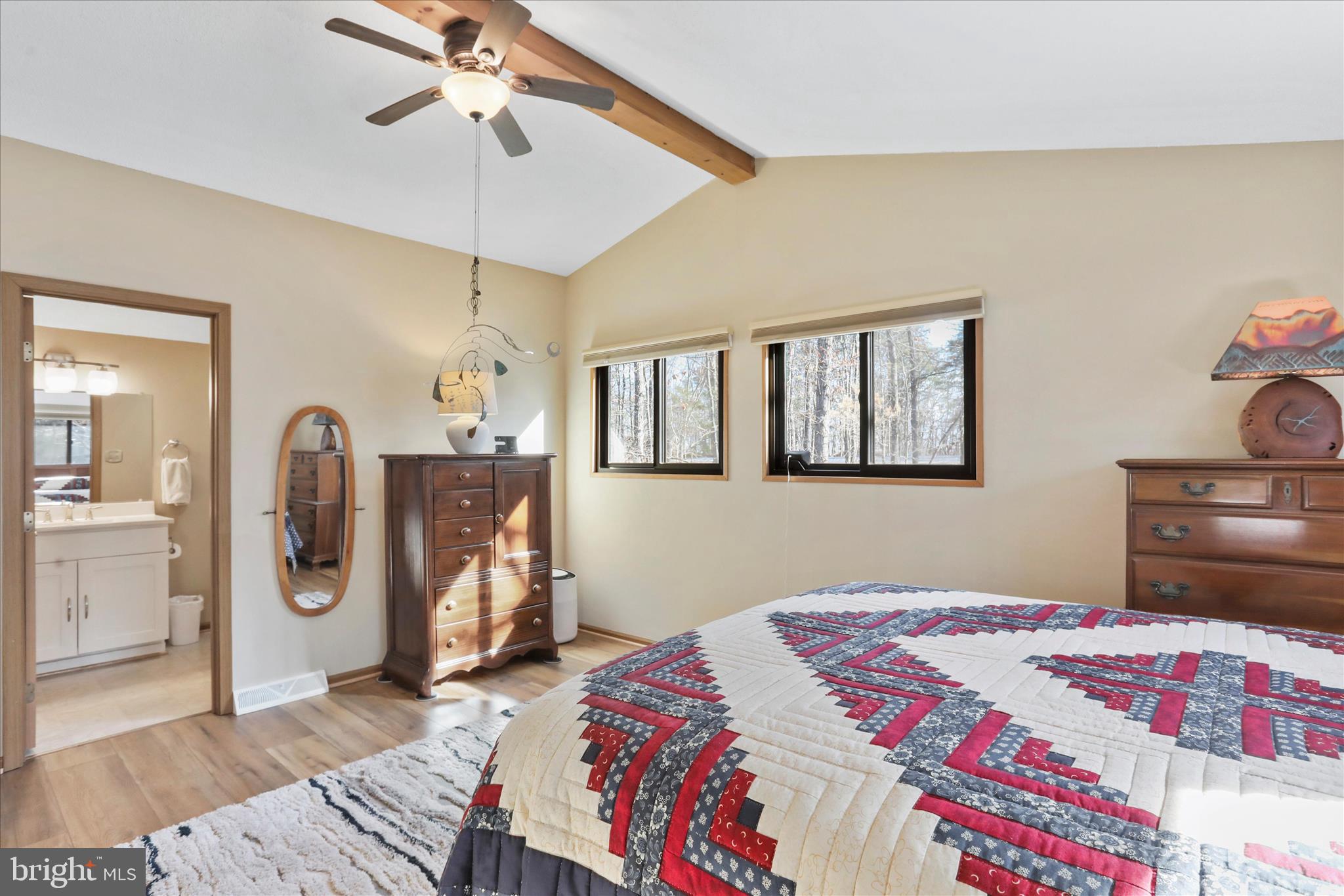 321 Clubhouse Ridge Hedgesville, WV 25427 - Photo 21 of 36 a bedroom with a bed and a chandelier