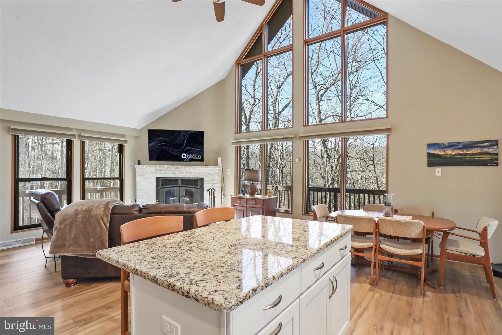 321 Clubhouse Ridge Hedgesville, WV 25427 - Photo 8 of 36 a view of a dining room with furniture window and wooden floor