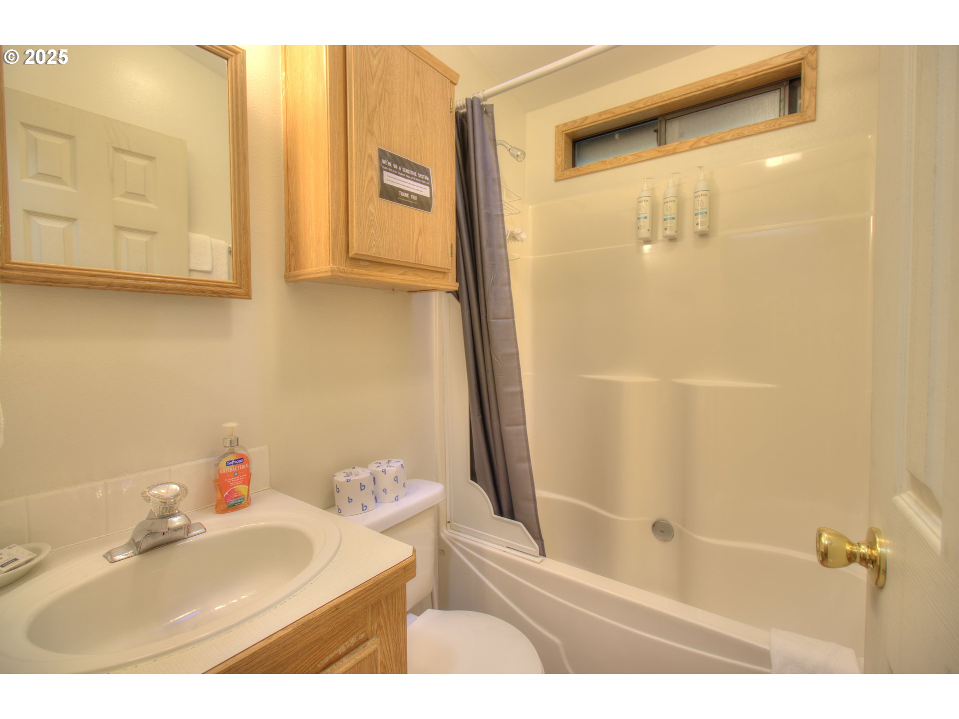 19921 Whaleshead Road, Unit C15 Brookings, OR 97415 - Photo 11 of 14 a bathroom with a sink and a mirror