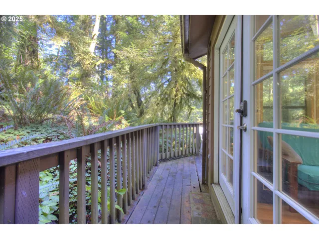 a view of a balcony with wooden floor