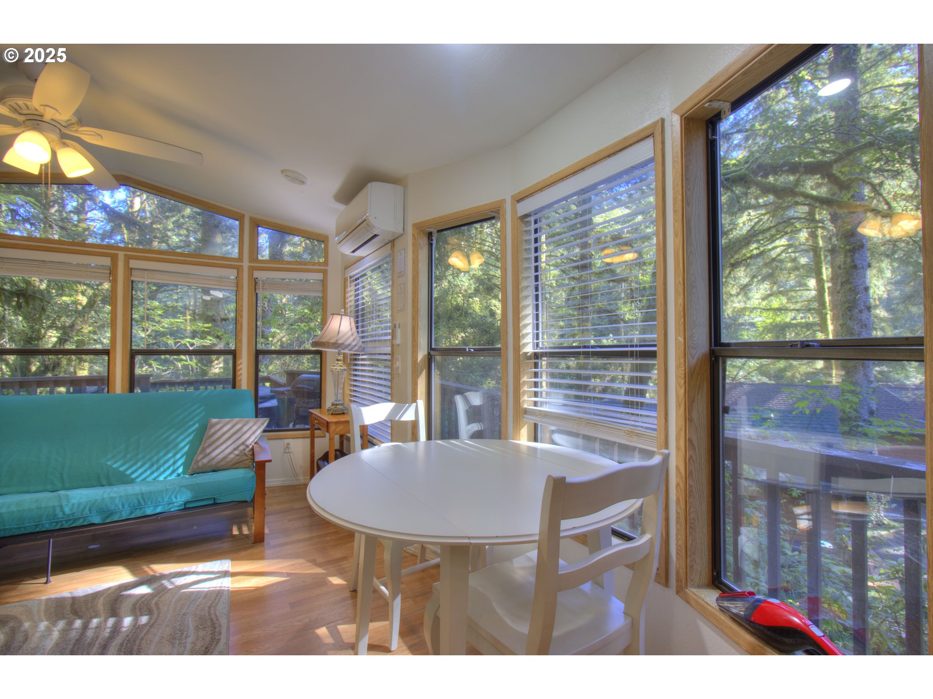 19921 Whaleshead Road, Unit C15 Brookings, OR 97415 - Photo 9 of 14 a view of a living room and floor to ceiling window