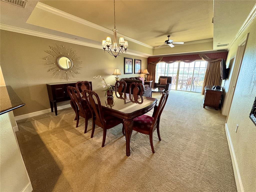1350 Centre Ct Ridge Drive, Unit 401 Reunion, FL 34747 - Photo 17 of 32 a view of a dining room with furniture and window