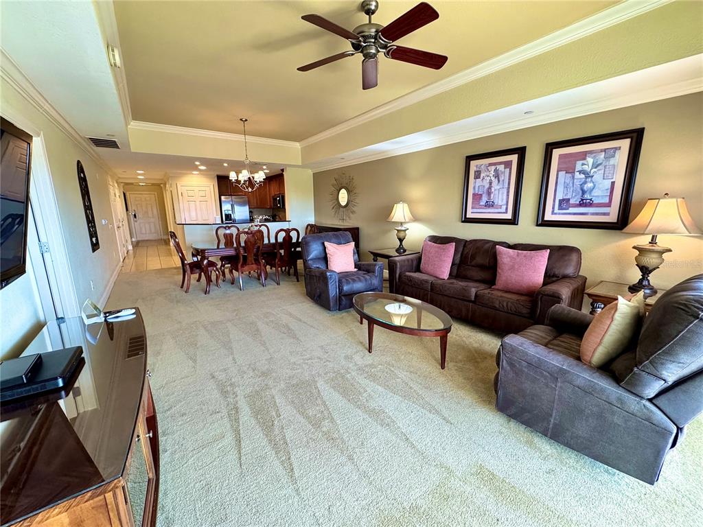 1350 Centre Ct Ridge Drive, Unit 401 Reunion, FL 34747 - Photo 19 of 32 a living room with furniture and a flat screen tv