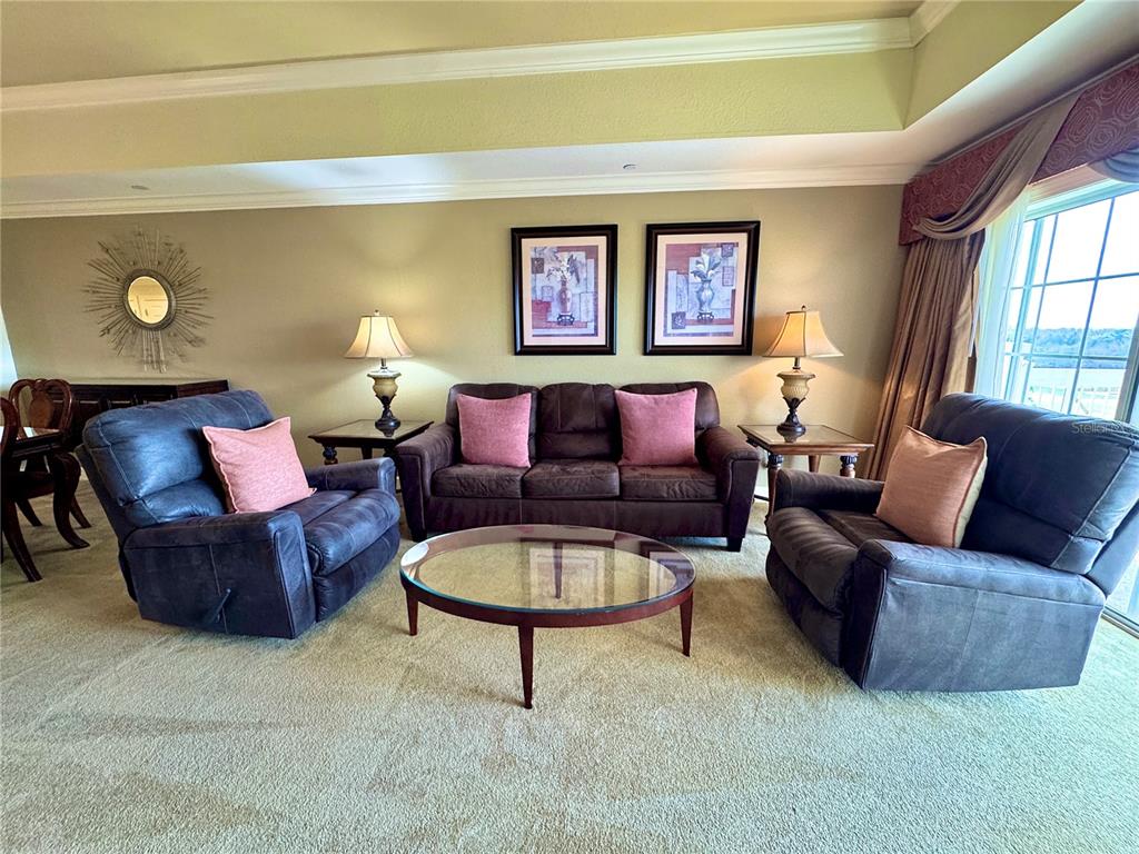 1350 Centre Ct Ridge Drive, Unit 401 Reunion, FL 34747 - Photo 21 of 32 a living room with furniture and a window