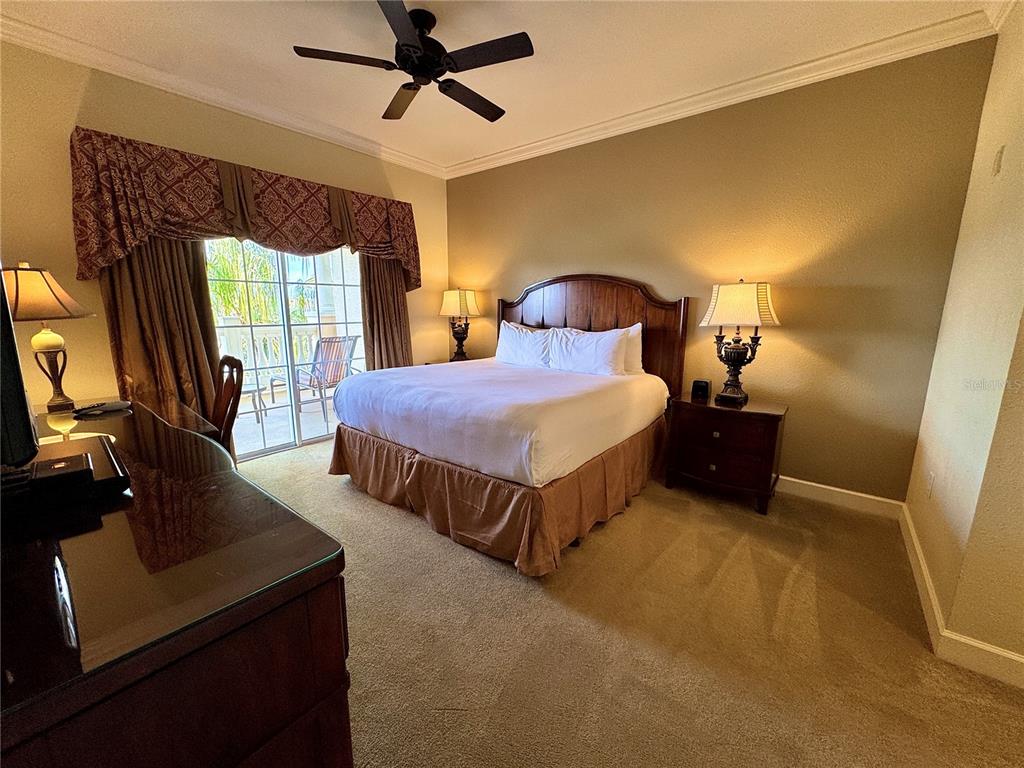 1350 Centre Ct Ridge Drive, Unit 401 Reunion, FL 34747 - Photo 22 of 32 a bedroom with double bed and a window