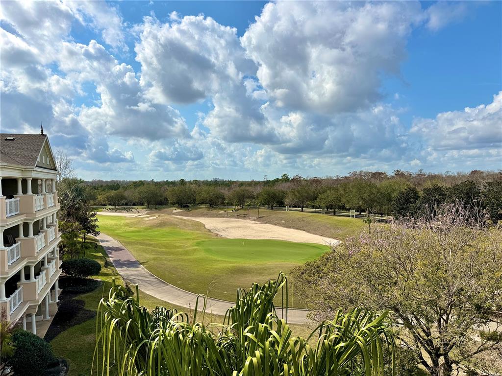 1350 Centre Ct Ridge Drive, Unit 401 Reunion, FL 34747 - Photo 29 of 32 a view of a lake with a yard