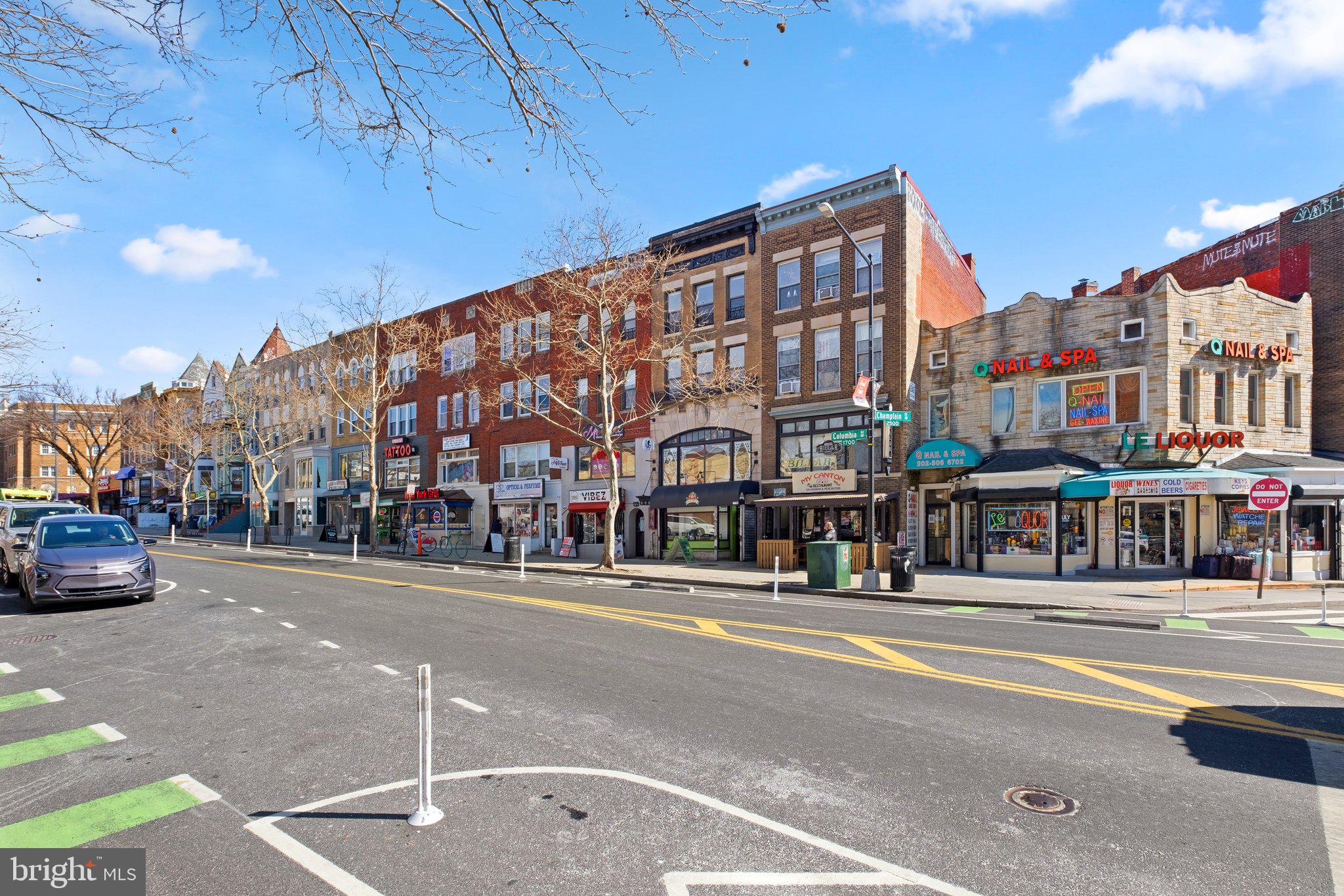 1763 Columbia Road Northwest, Unit 510 Washington, DC 20009 - Photo 17 of 17 a city street lined with buildings and cars