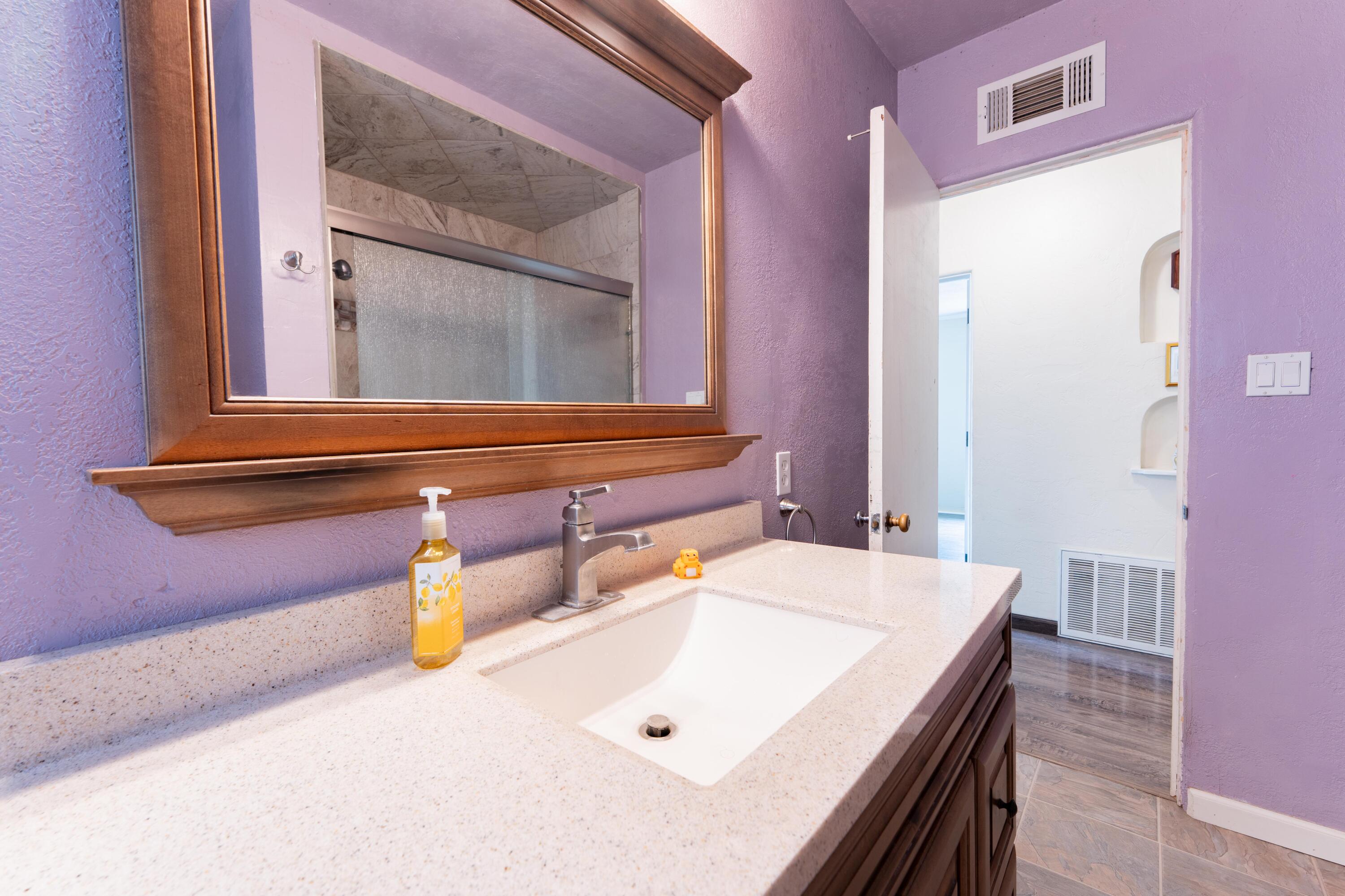 570 North Birch Avenue Reedley, CA 93654 - Photo 38 of 52 a bathroom with a sink and a mirror