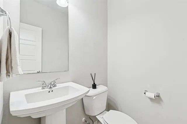 a bathroom with a sink and a toilet