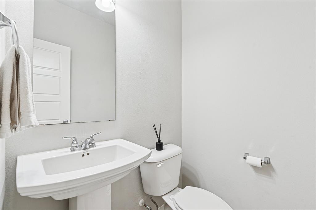 1813 Drover Creek Road Aubrey, TX 76227 - Photo 22 of 36 Half bath perfect for guests to utilitize