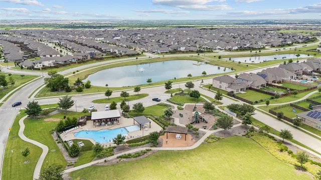 an aerial view of a house with a swimming pool