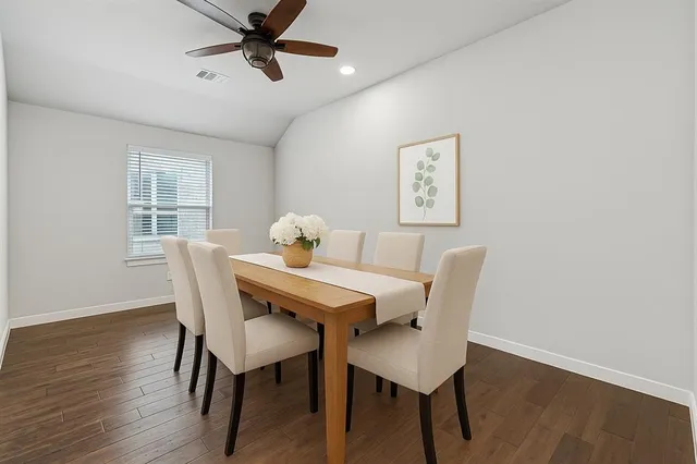 a view of a dining room with furniture and window