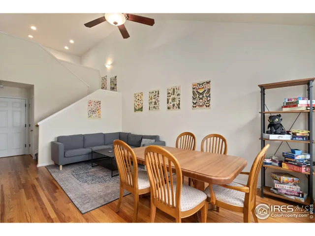 a view of a room with furniture and wooden floor