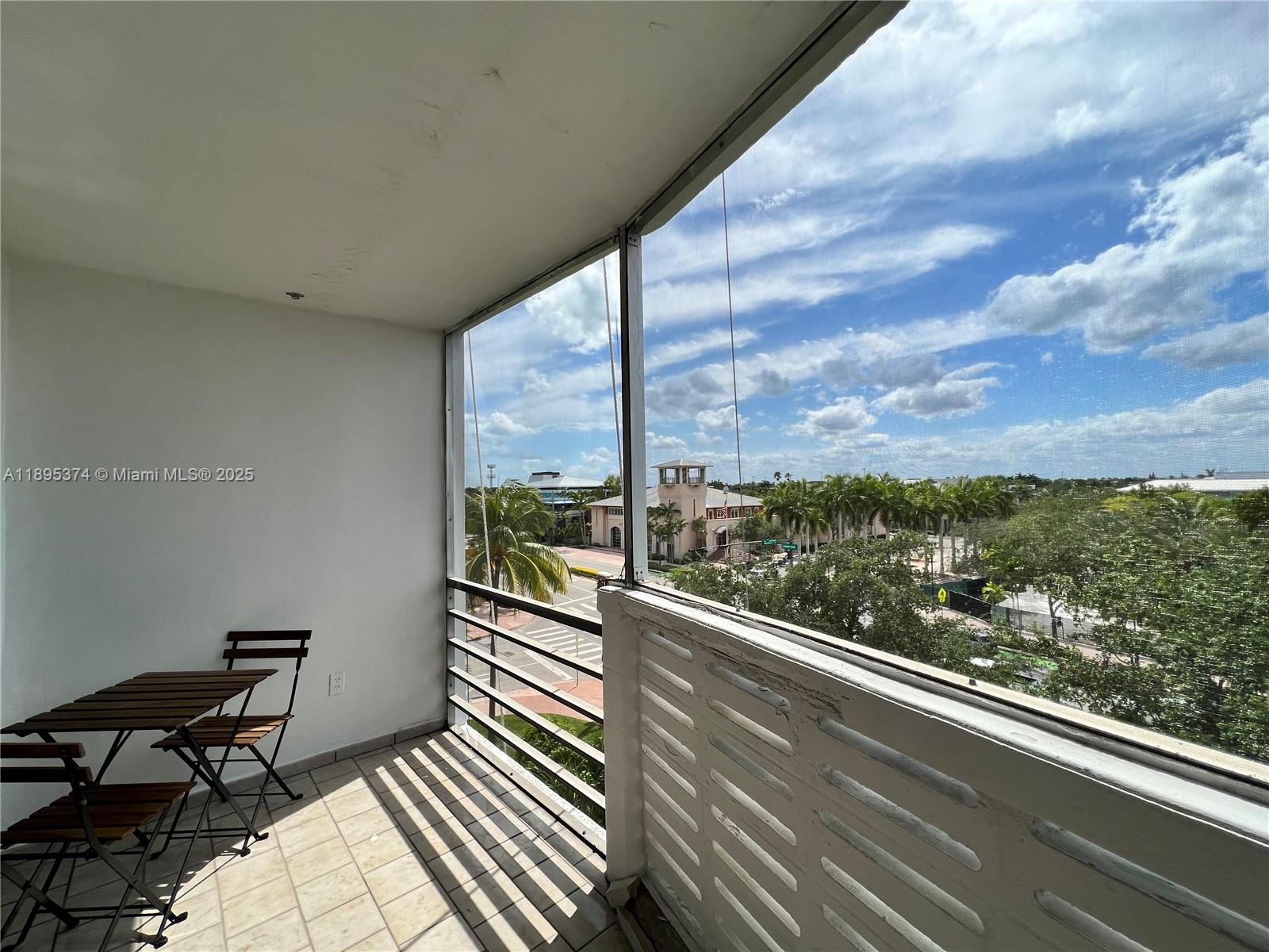 555 Crandon Boulevard, Unit 53 Key Biscayne, FL 33149 - Photo 28 of 33 a view of a balcony with chairs